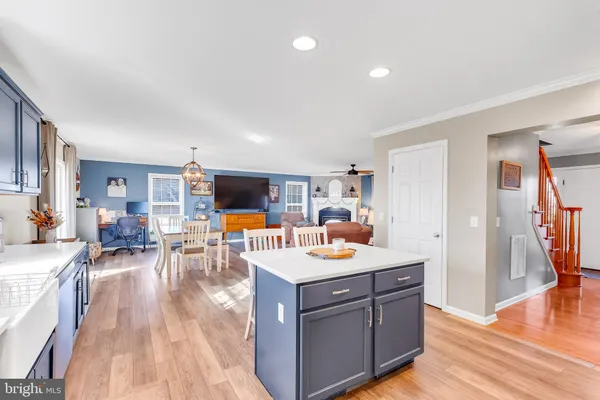 a open kitchen with a table and chairs