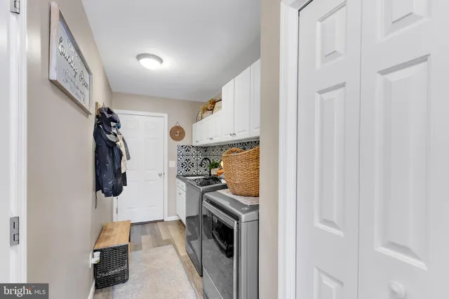 a kitchen with a refrigerator and cabinets