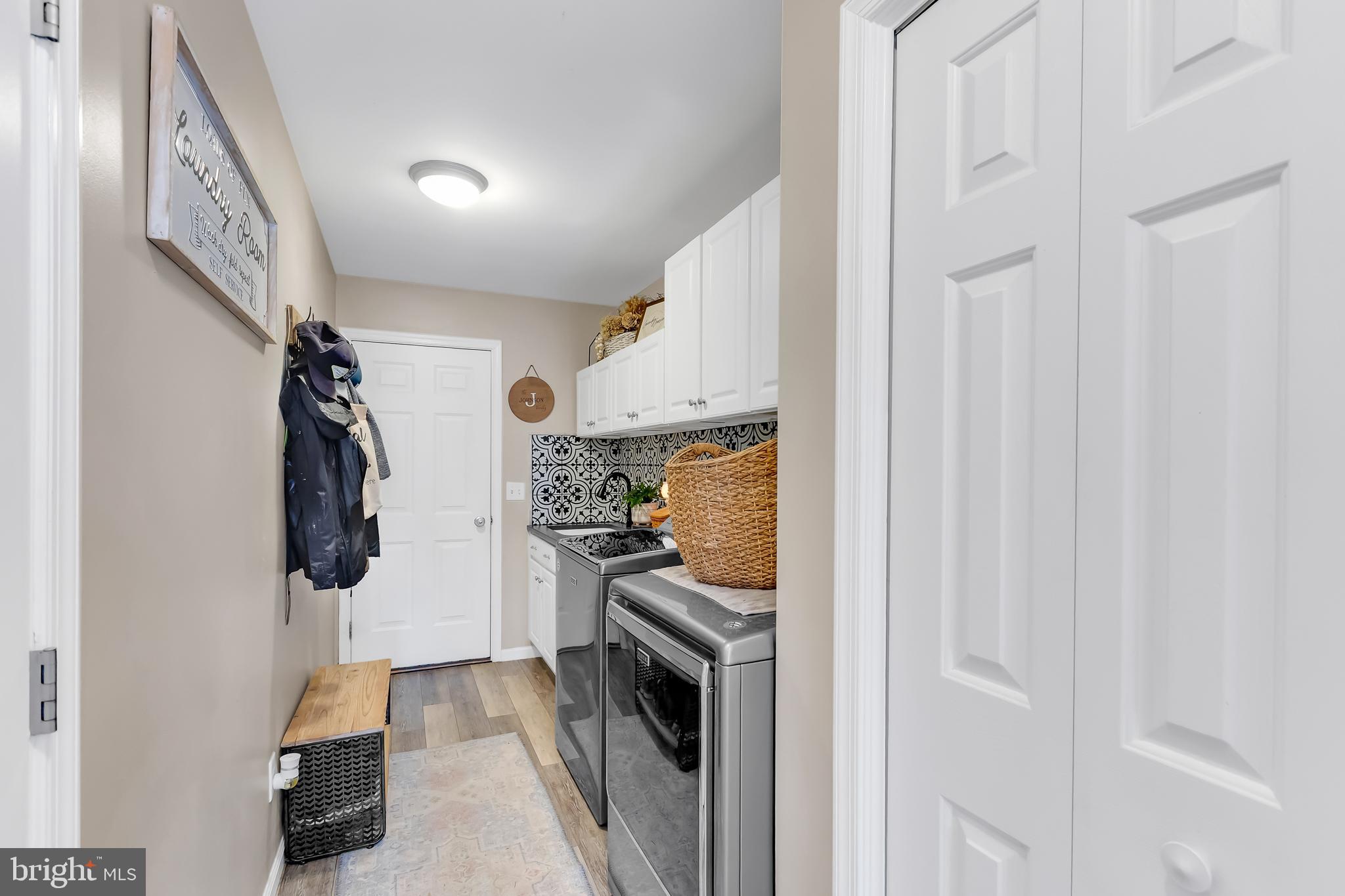 8960 Bacons Road Delmar, DE 19940 - Photo 24 of 51 a kitchen with a refrigerator and cabinets