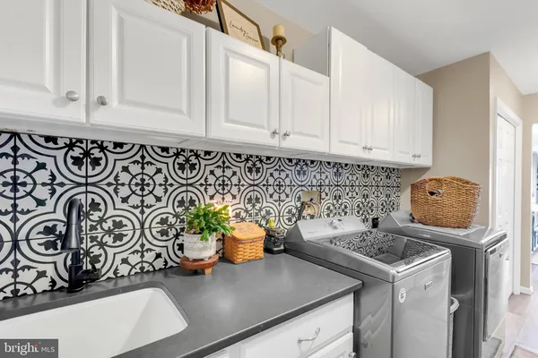 a kitchen with a stove and cabinets