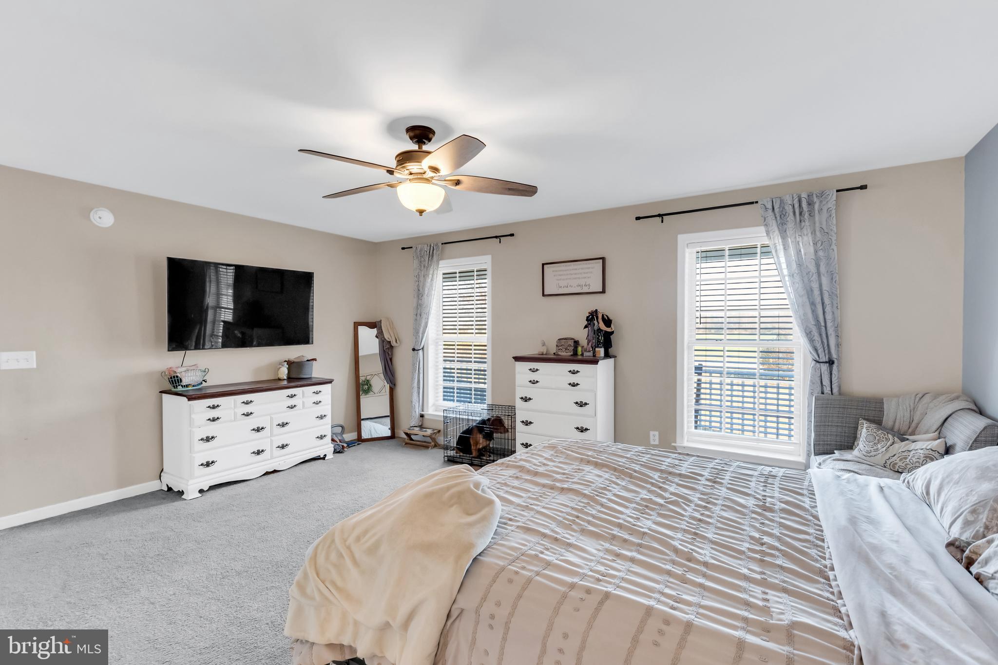 8960 Bacons Road Delmar, DE 19940 - Photo 28 of 51 a spacious bedroom with a bed and a flat screen tv