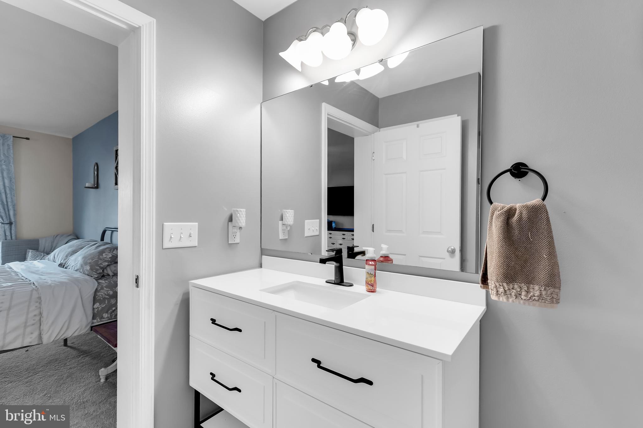 8960 Bacons Road Delmar, DE 19940 - Photo 31 of 51 a bathroom with a sink vanity and a mirror