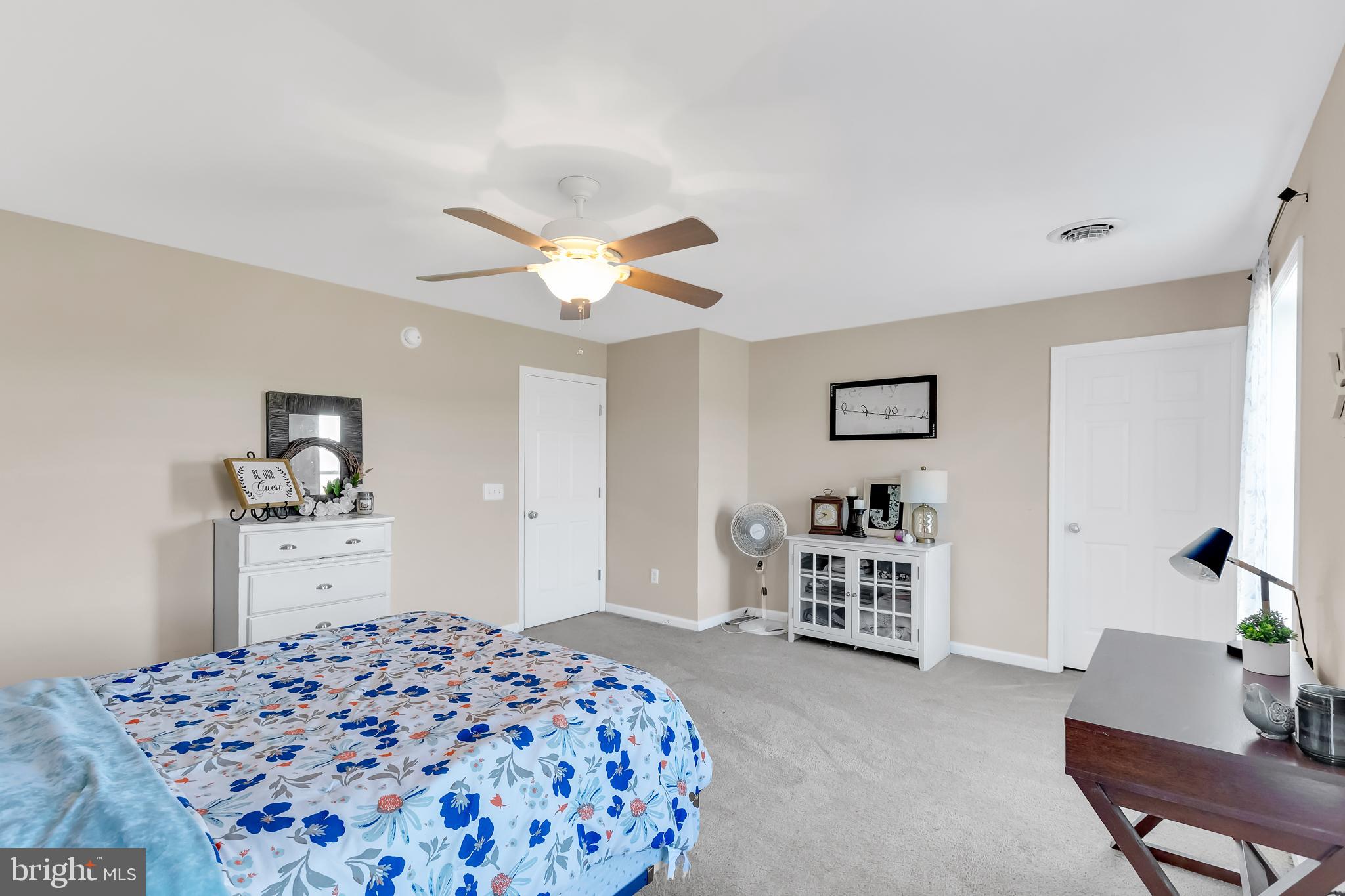 8960 Bacons Road Delmar, DE 19940 - Photo 37 of 51 a bedroom with a bed and dresser