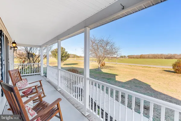 a view of a balcony with ocean view