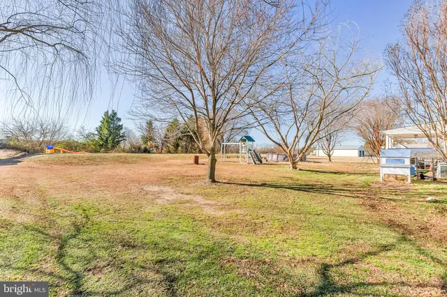 a view of a patio with a table and chairs