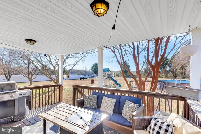 a view of a yard with snow on the road