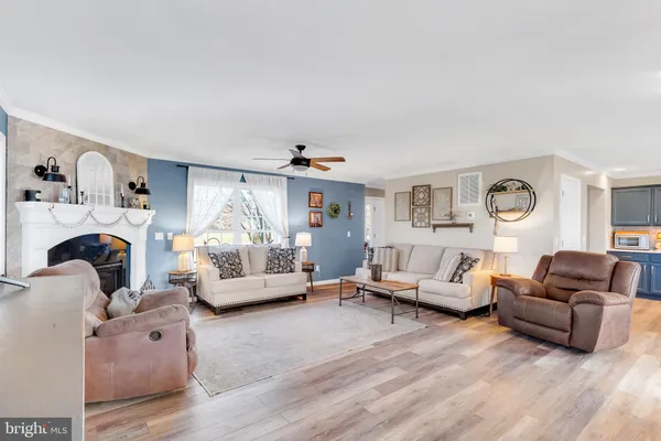 a living room with furniture or couch and a large window