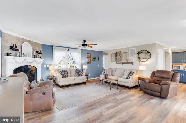 a living room with furniture or couch and a large window