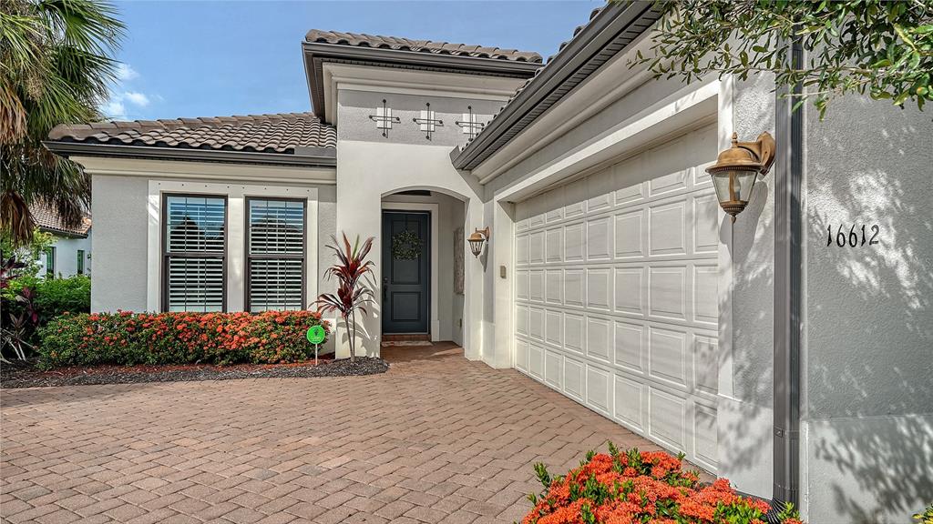 16612 Collingtree Crossing Lakewood Ranch, FL 34202 - Photo 1 of 1 a front view of a house with a yard