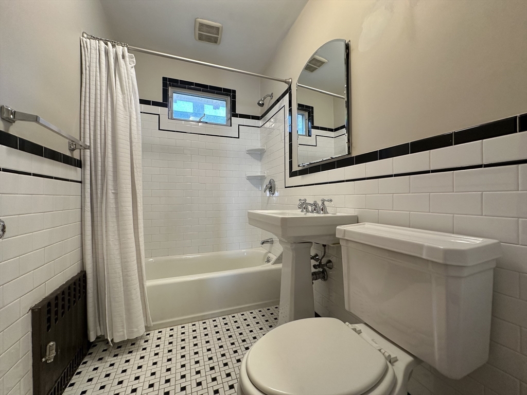 77 Walk Hill Street, Unit 1 Boston, MA 02130 - Photo 16 of 29 a bathroom with a sink toilet and shower