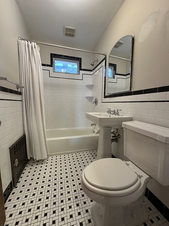 77 Walk Hill Street, Unit 1 Boston, MA 02130 - Photo 17 of 29 a bathroom with a sink a toilet and shower