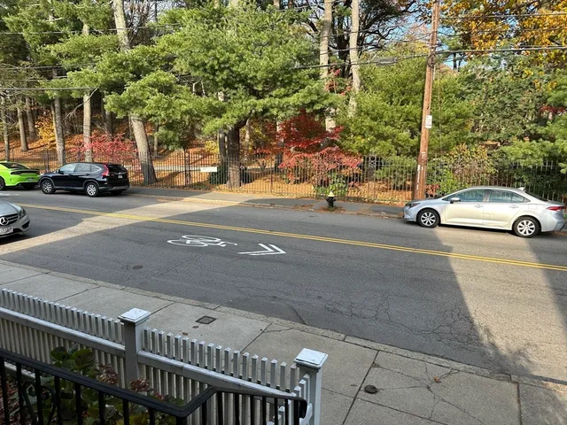 a view of a street with cars