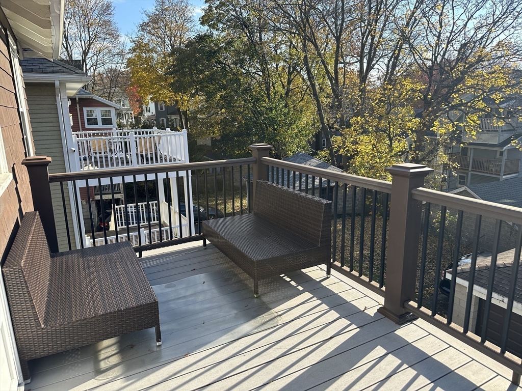 77 Walk Hill Street, Unit 1 Boston, MA 02130 - Photo 28 of 29 a view of balcony with wooden floor and fence