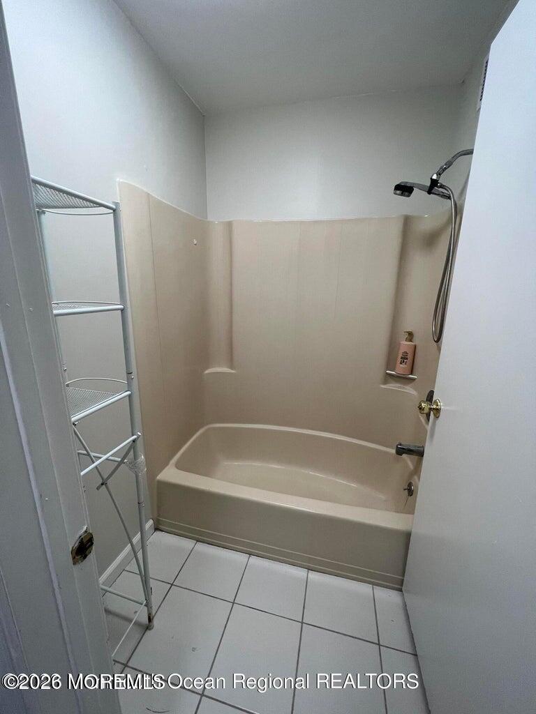 12-7 Phoenix Court Freehold, NJ 07728 - Photo 9 of 12 a bathroom with a bath tub and a shower