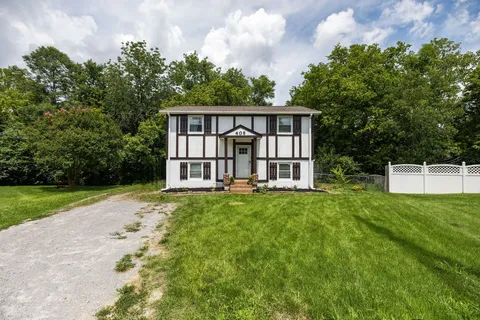 a view of a backyard with a garden and entertaining space