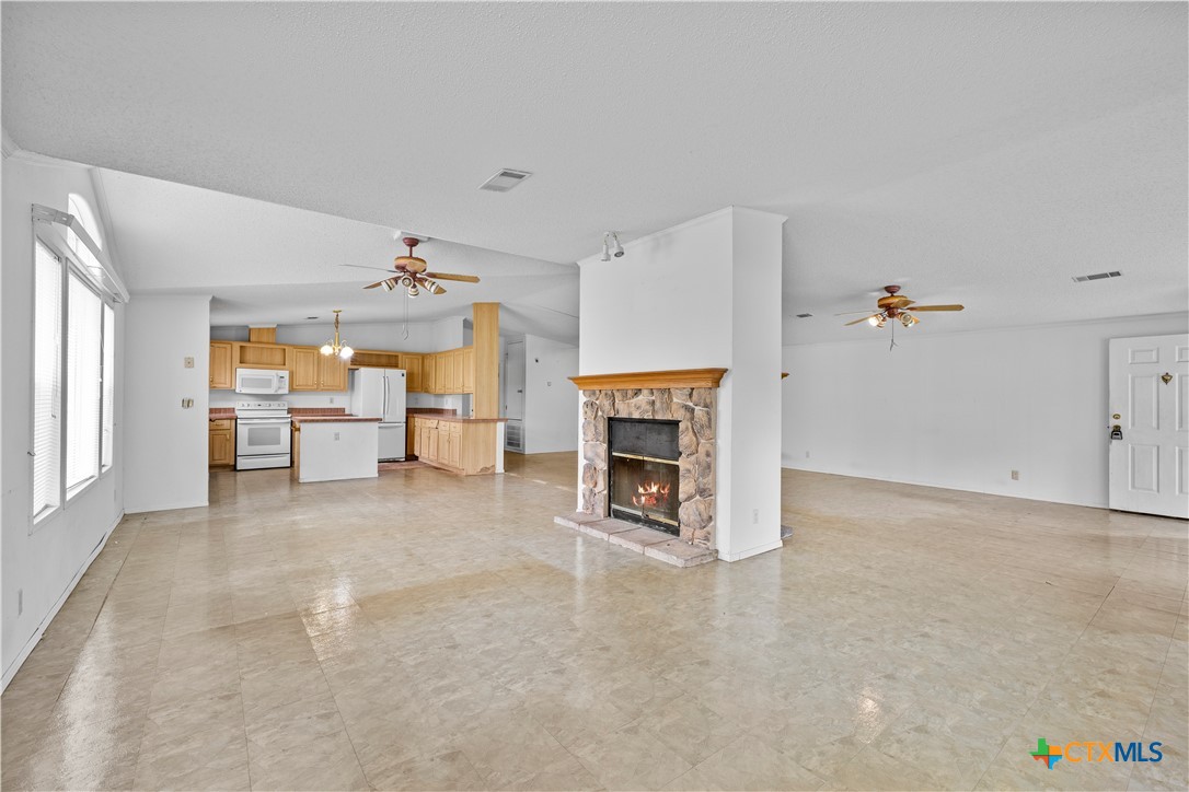 1189 Vivroux Ranch Road Seguin, TX 78155 - Photo 3 of 34 Living room open to kitchen