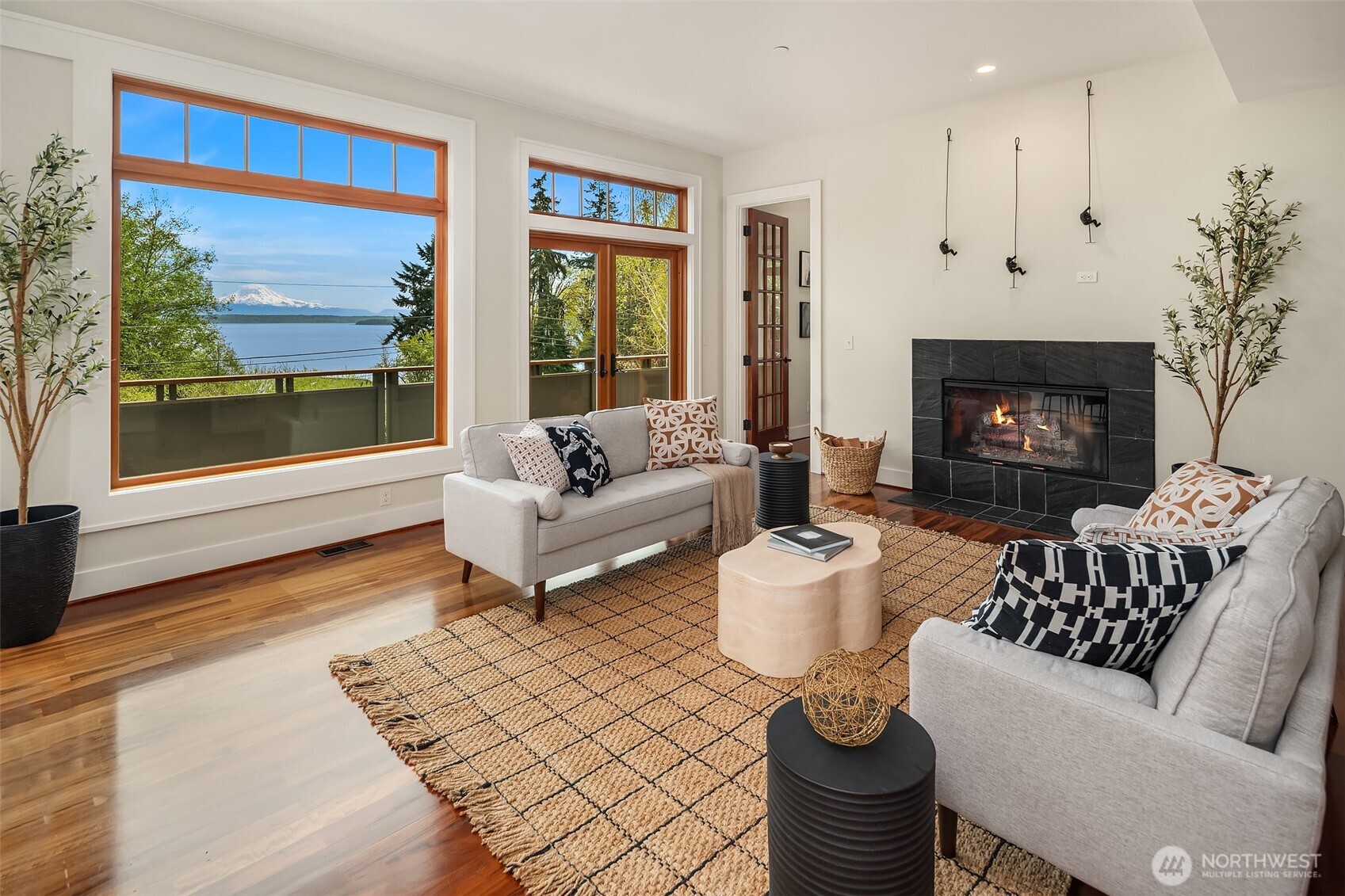 8302 Southwest Dilworth Road Vashon, WA 98070 - Photo 6 of 40 a living room with furniture and a fireplace