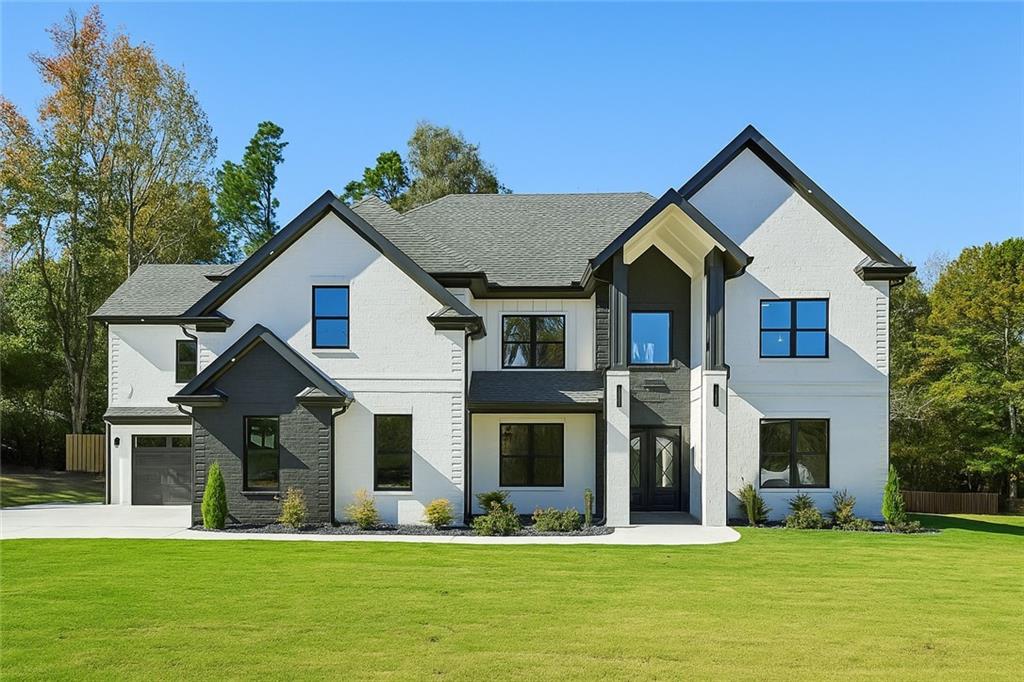 4292 Sardis Church Road Buford, GA 30519 - Photo 1 of 1 a front view of a house with a yard