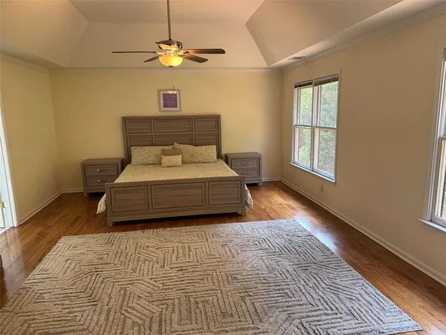 a living room with a bed furniture and a window