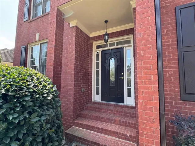a front view of a house with a garage