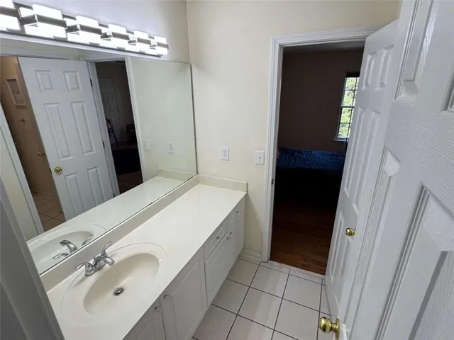 a bedroom with furniture and a wooden floor