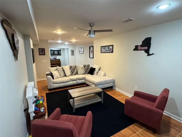 a bedroom with a bed and a lamp on table