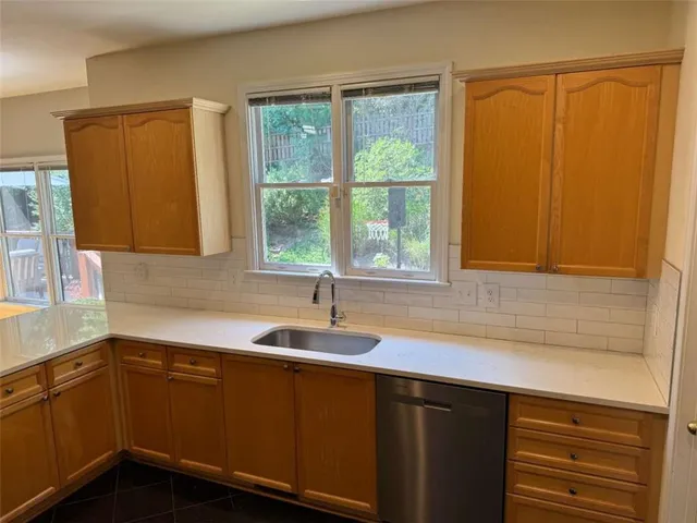 a kitchen with a sink and a window