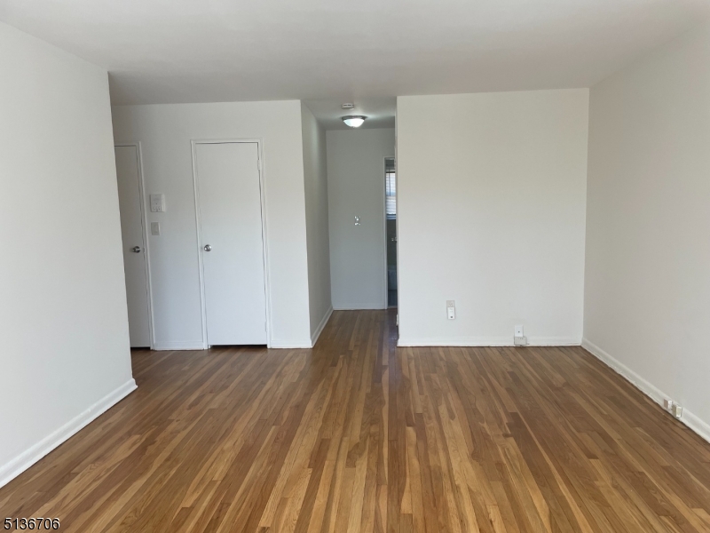 948 Valley Road, Unit A7 Clifton, NJ 07013 - Photo 6 of 9 a view of a room with wooden floor and a sink