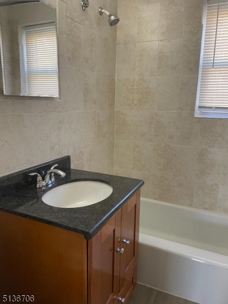 948 Valley Road, Unit A7 Clifton, NJ 07013 - Photo 8 of 9 a bathroom with a sink and a bathtub