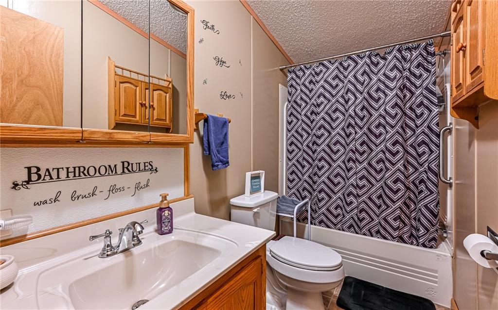 307 Hungarian Road Slippery Rock, PA 16057 - Photo 16 of 34 a bathroom with a sink and a toilet