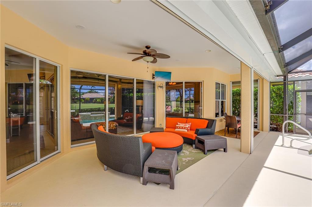 6769 Bent Grass Drive Naples, FL 34113 - Photo 19 of 32 a outdoor space with patio the couches and a dining table with the garden view