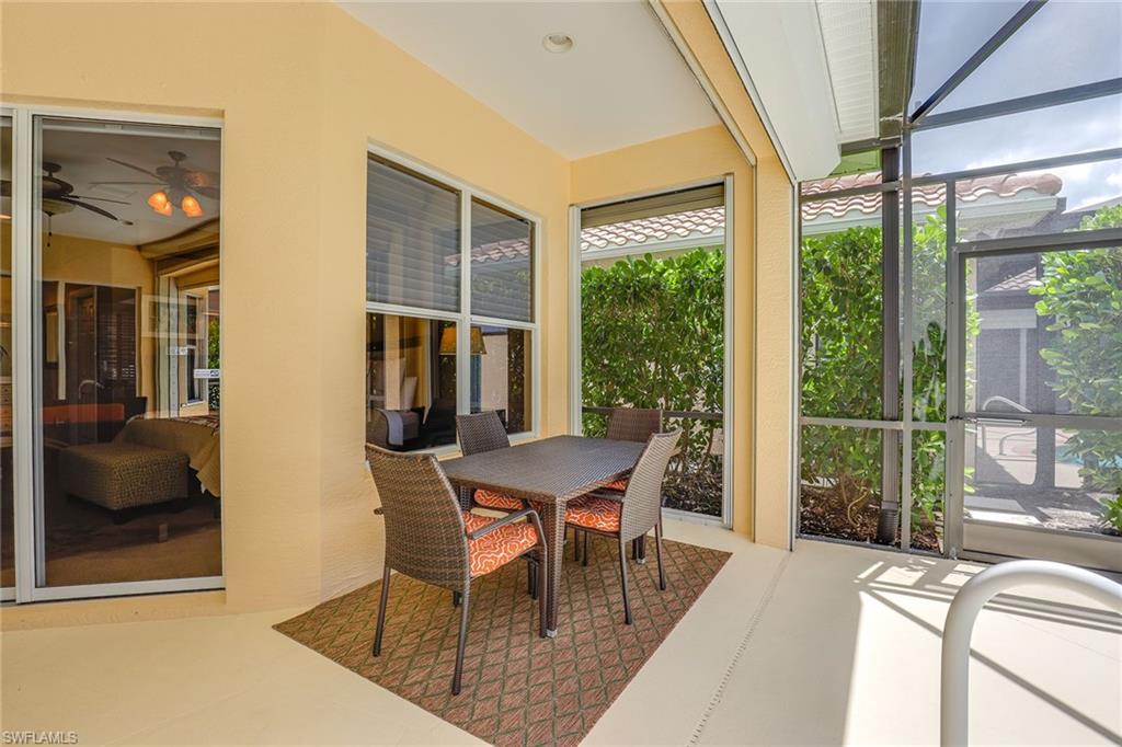 6769 Bent Grass Drive Naples, FL 34113 - Photo 20 of 32 a dining room with furniture and window