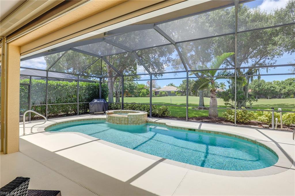 6769 Bent Grass Drive Naples, FL 34113 - Photo 22 of 32 a view of a backyard with a garden and plants