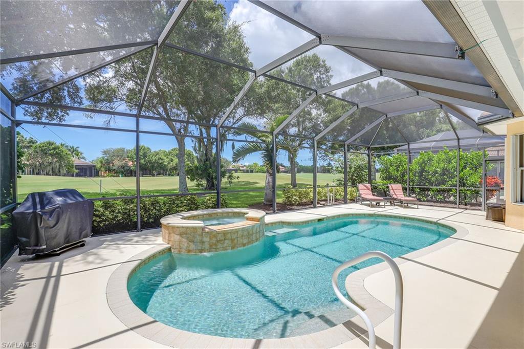 6769 Bent Grass Drive Naples, FL 34113 - Photo 23 of 32 a view of a backyard with sitting area and furniture