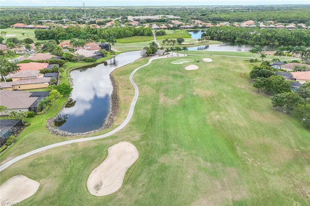 6769 Bent Grass Drive Naples, FL 34113 - Photo 28 of 32 a view of a swimming pool with a yard