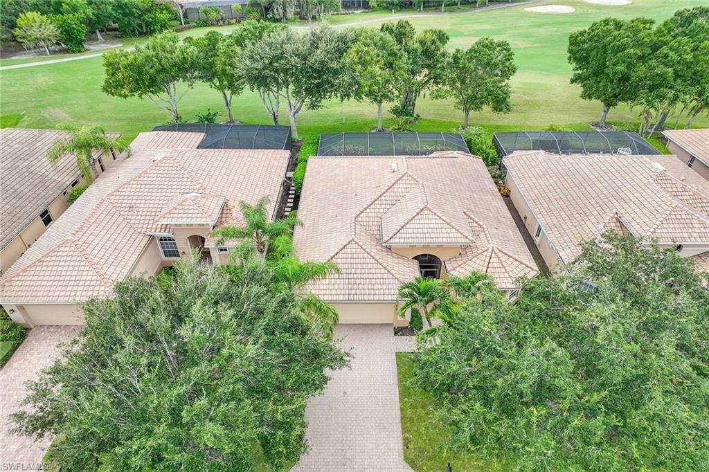 6769 Bent Grass Drive Naples, FL 34113 - Photo 3 of 32 a aerial view of a house with garden