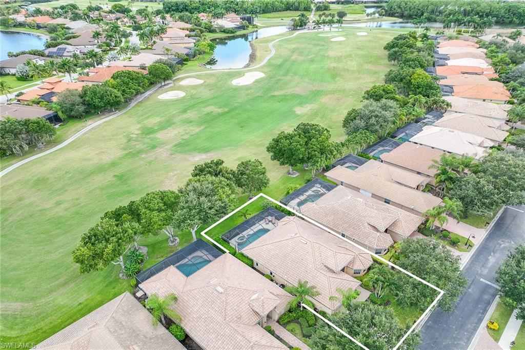 6769 Bent Grass Drive Naples, FL 34113 - Photo 32 of 32 a view of a yard with plants