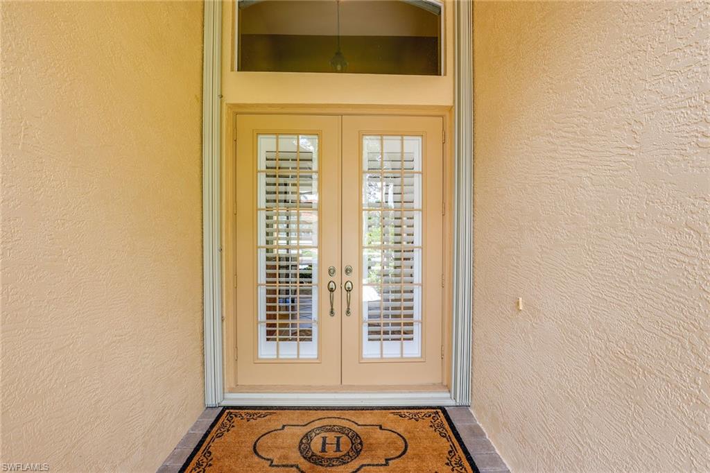 6769 Bent Grass Drive Naples, FL 34113 - Photo 4 of 32 a view of an entryway of a house
