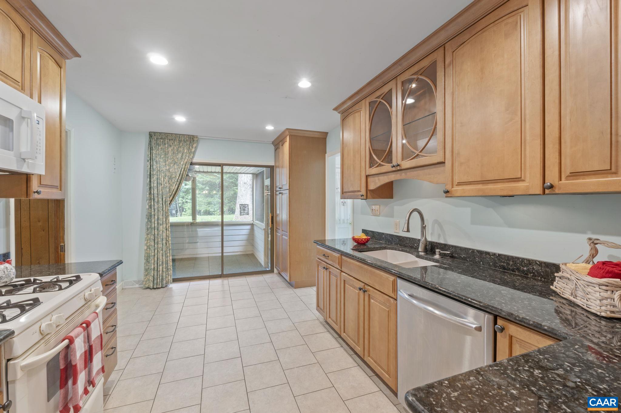 1211 Lanetown Road Crozet, VA 22932 - Photo 18 of 50 a kitchen with stainless steel appliances granite countertop a sink stove and cabinets