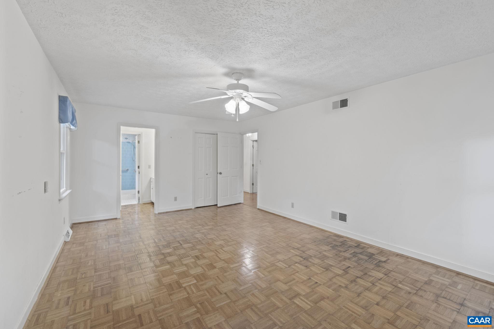 1211 Lanetown Road Crozet, VA 22932 - Photo 33 of 50 a view of an empty room with a ceiling fan