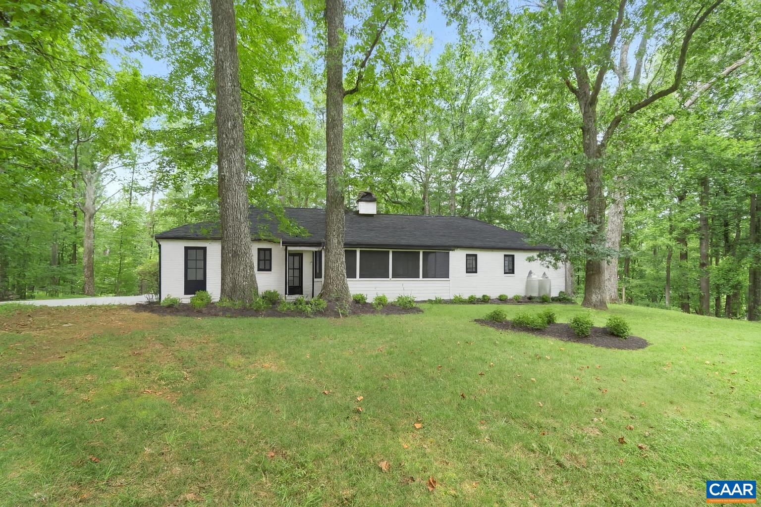 1211 Lanetown Road Crozet, VA 22932 - Photo 4 of 50 a front view of a house with a garden
