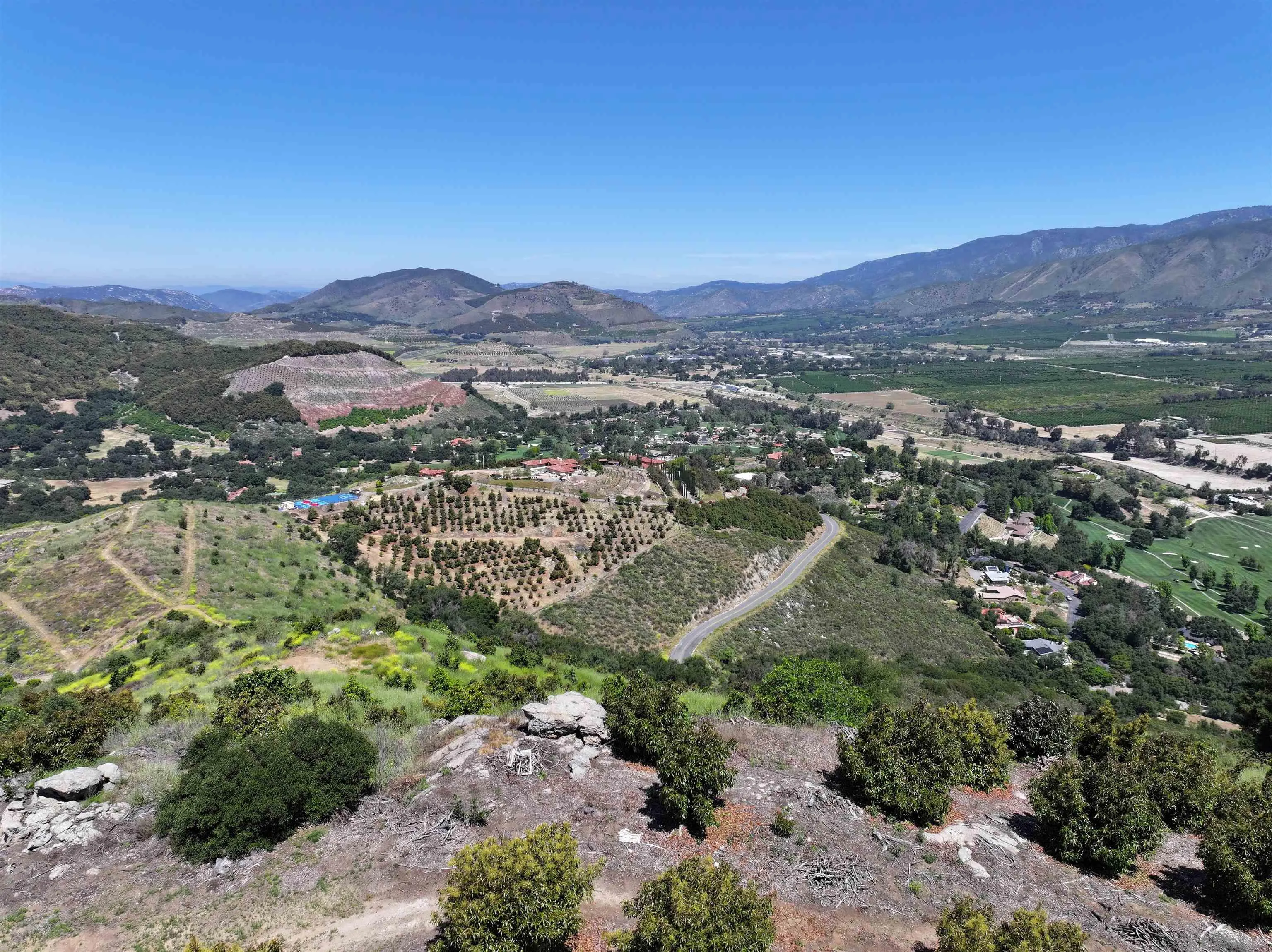 31752 Pauma Heights Road, Unit 2 Valley Center, CA 92061 - Photo 3 of 7 a view of a lush green hillside and houses