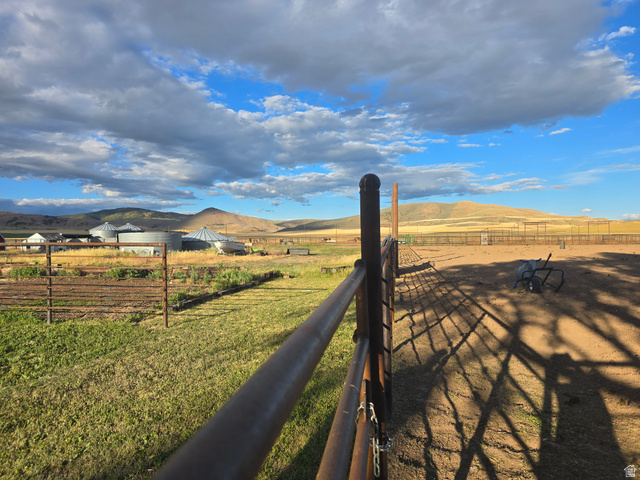 34200 Coulam Road Swan Lake, ID 83281 - Photo 17 of 24 Expansive fenced outdoor area featuring a dirt surface and distant mountain scenery