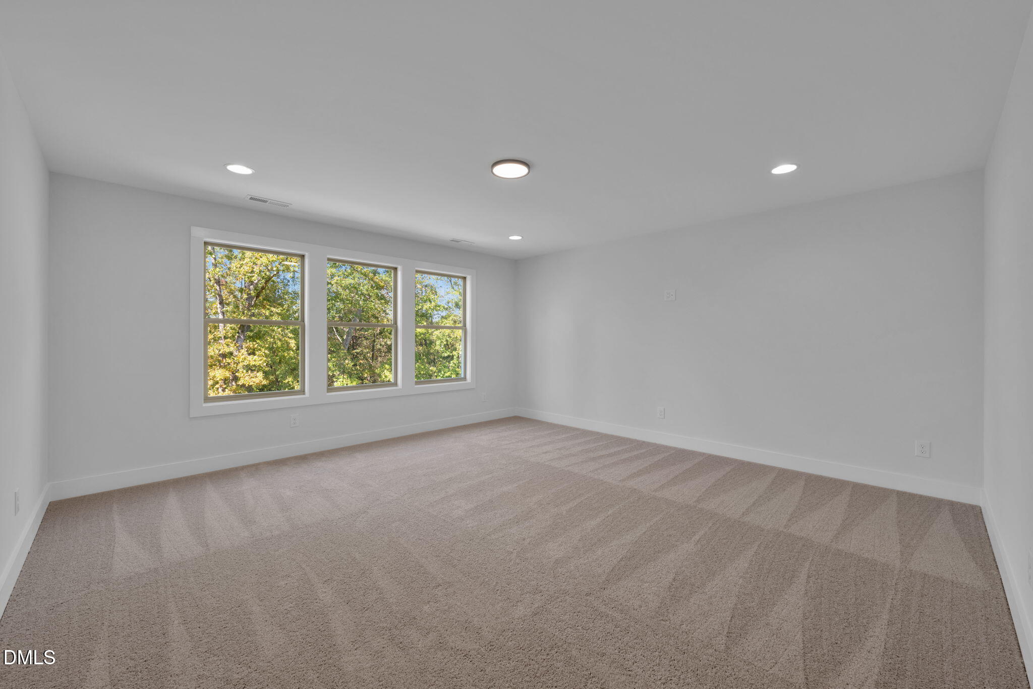 966 Double Helix Road Apex, NC 27523 - Photo 25 of 36 a view of a big room with windows and chandelier fan