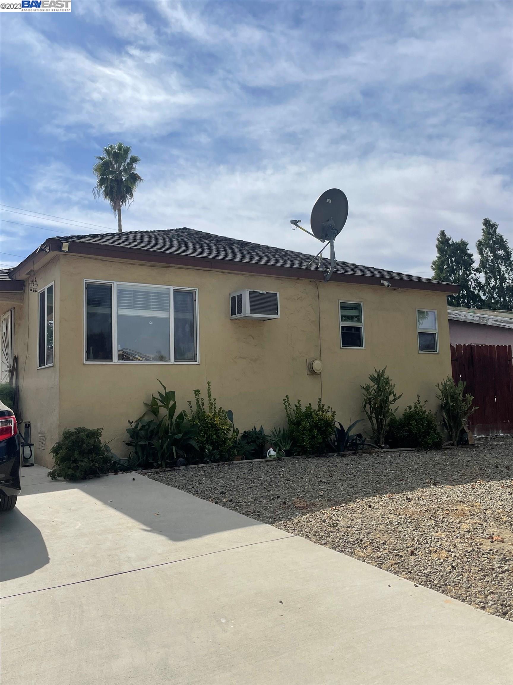 2836 Pixie Drive Stockton, CA 95203 - Photo 1 of 10 a front view of a house with garden