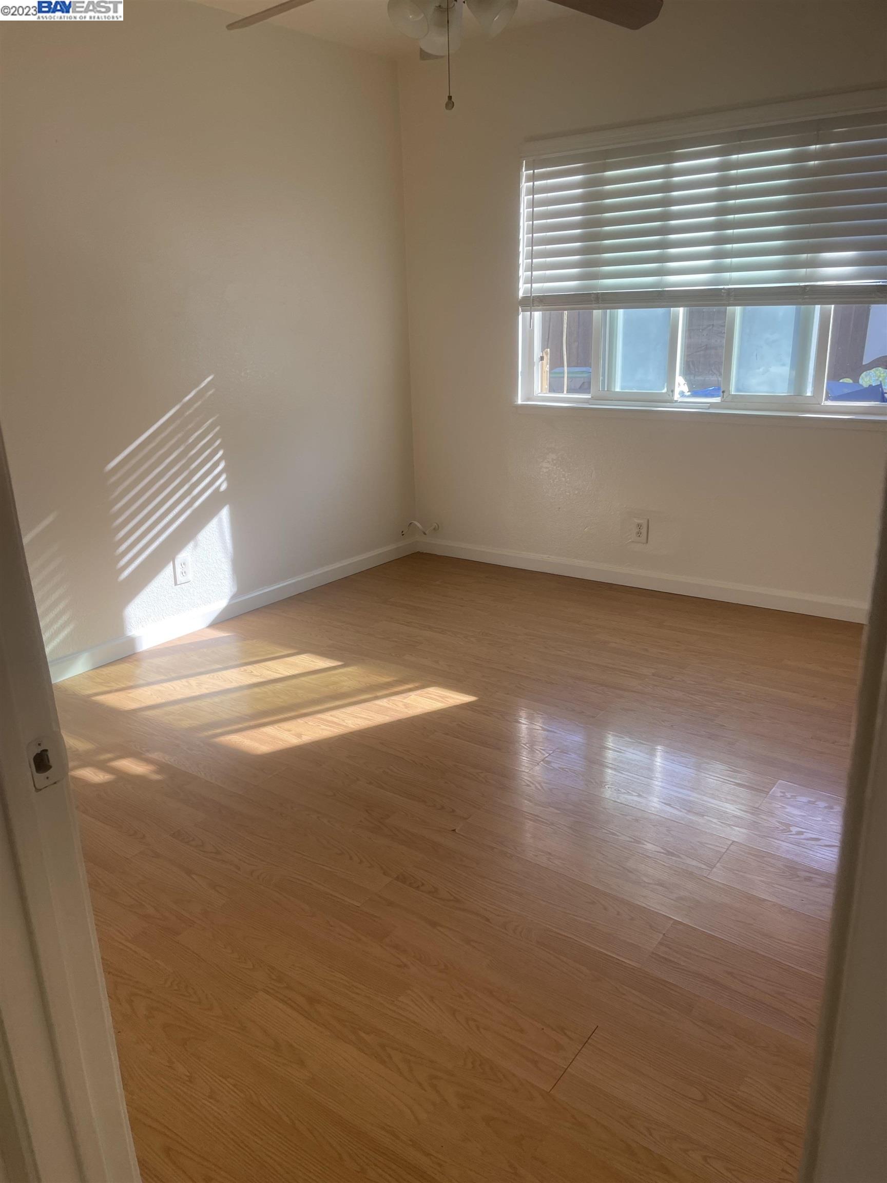 2836 Pixie Drive Stockton, CA 95203 - Photo 2 of 10 a view of empty room with wooden floor and fan