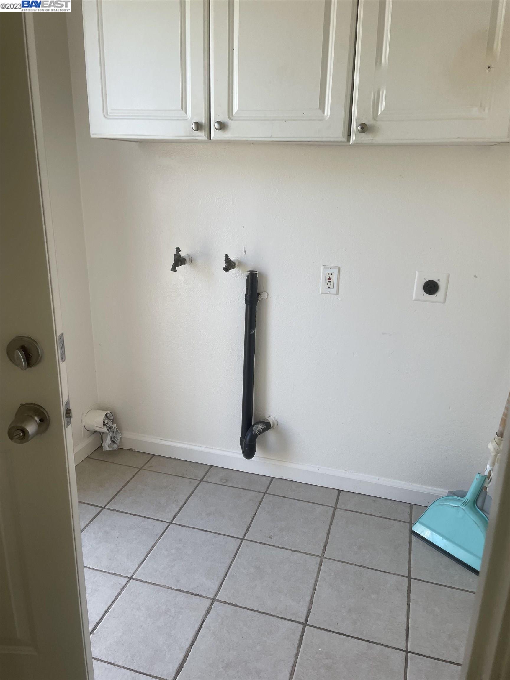 2836 Pixie Drive Stockton, CA 95203 - Photo 6 of 10 a view of a utility room with granite countertop cabinets