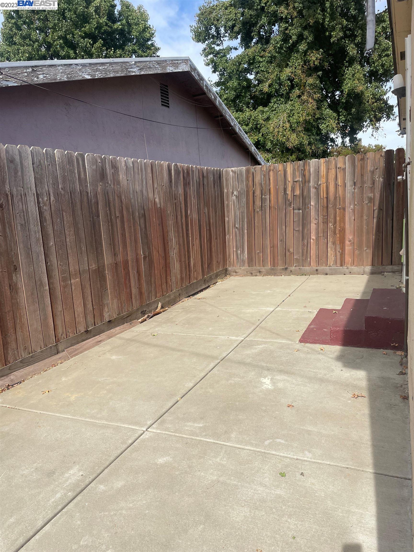 2836 Pixie Drive Stockton, CA 95203 - Photo 9 of 10 a view of backyard with wooden fence
