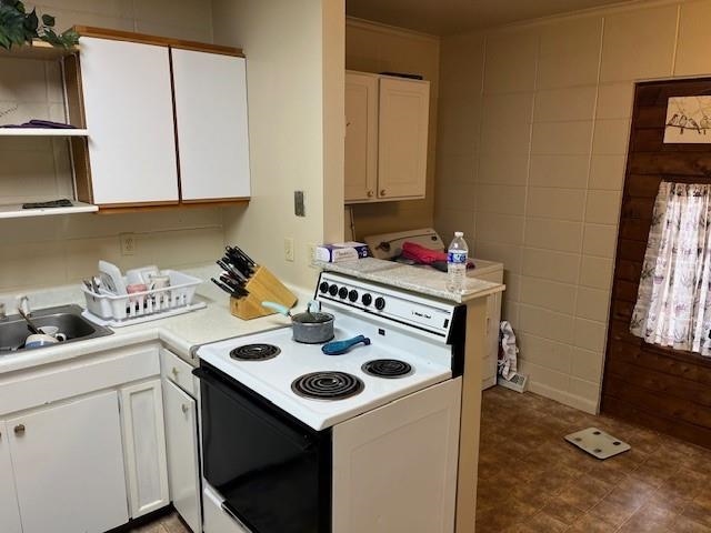 257 29 Road Grand Junction, CO 81503 - Photo 5 of 8 a kitchen with a sink a stove and cabinets