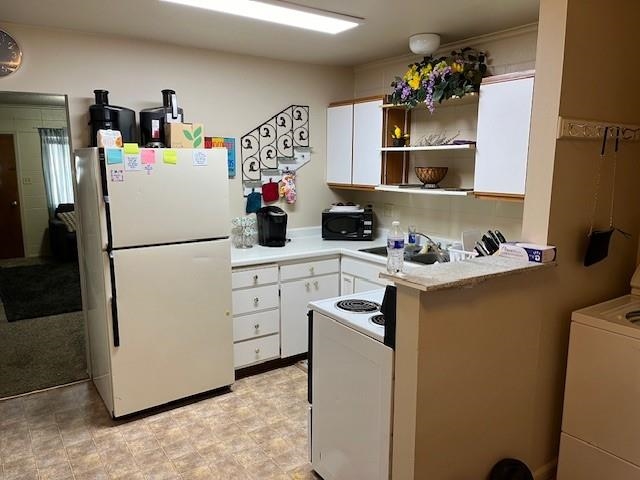 257 29 Road Grand Junction, CO 81503 - Photo 6 of 8 a white refrigerator freezer sitting inside of a kitchen